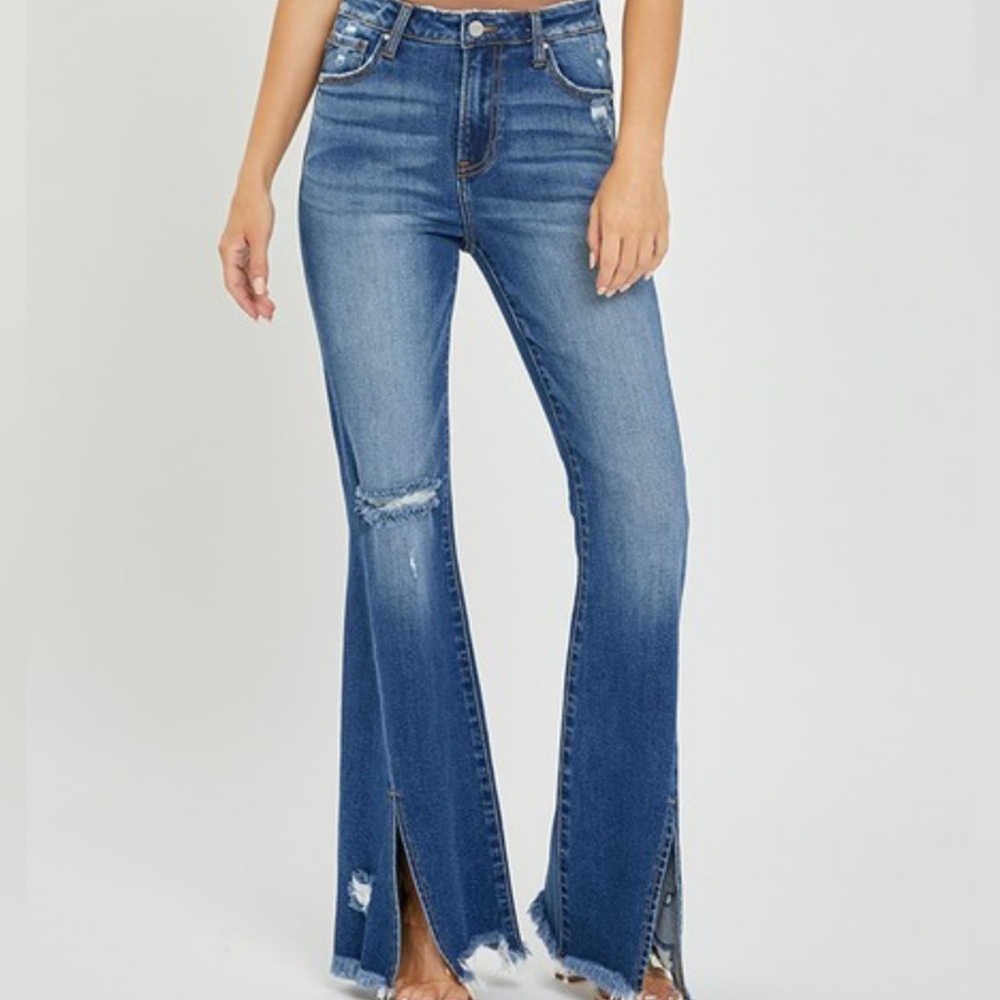 Risen high-rise flare jeans with front slit and frayed hem—bold and trendy!